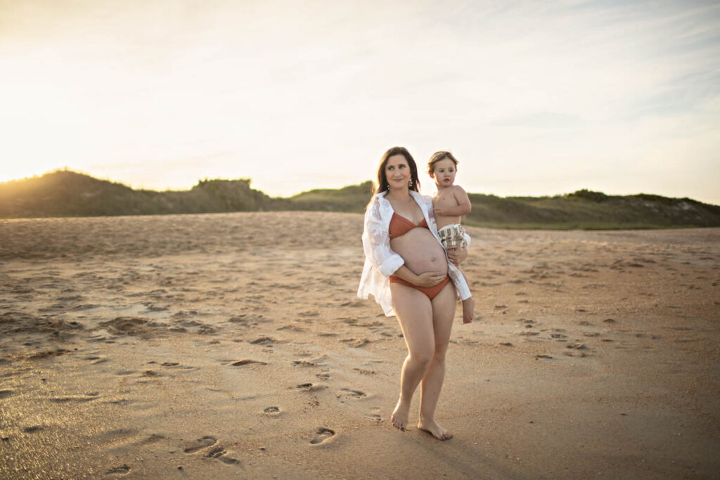 Pregnant mother at Guana Beach maternity session with her toddler.