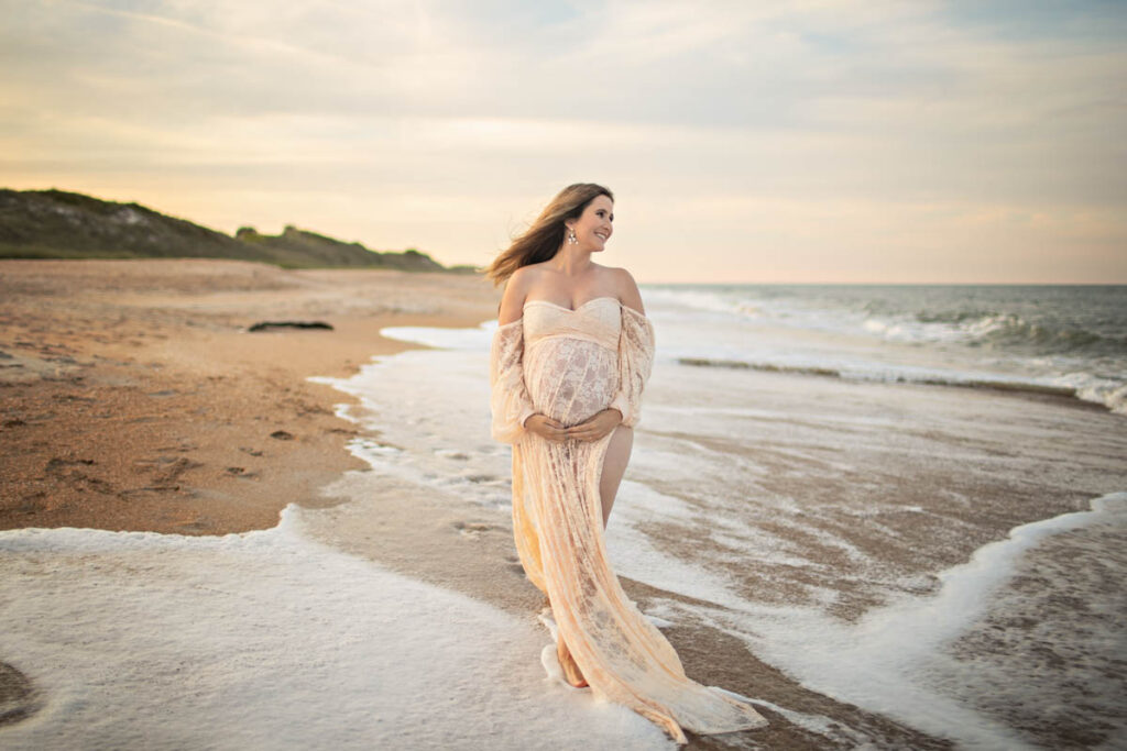 Cream maternity gown worn for a Guana beach maternity session